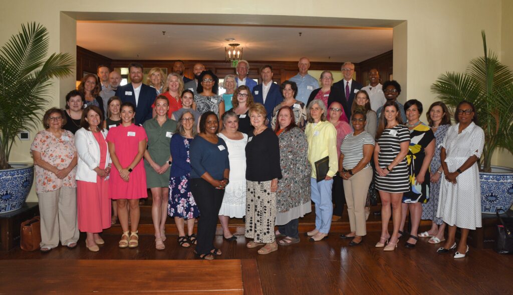 Grant recipients from small organizations gather with the Trinity Health Foundation Board of Directors.